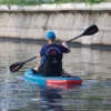 Inflatable touring board setup with kayak seat and footrest