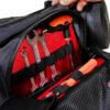 Motorcycle waist bag showing internal mesh pocket with smartphone storage