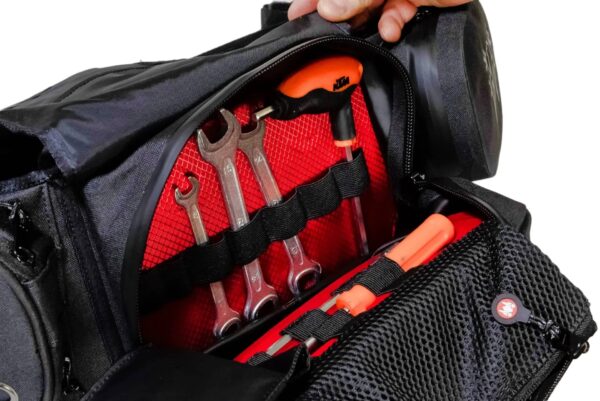 Motorcycle waist bag showing internal mesh pocket with smartphone storage