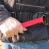 Quick-release red strap adjustment system on Amphibious OFF-WAIST bag