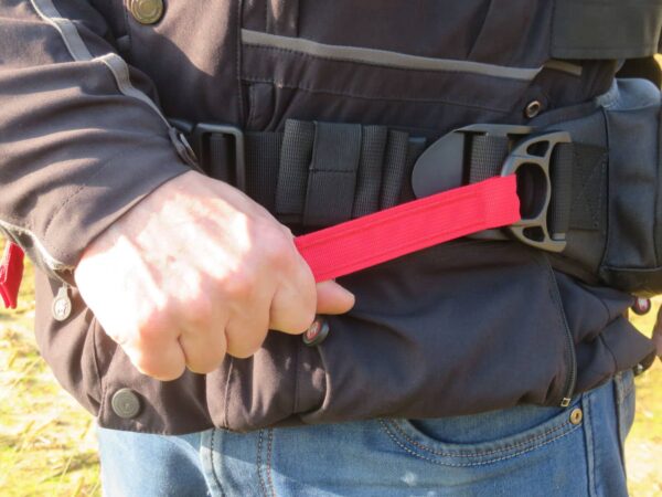 Quick-release red strap adjustment system on Amphibious OFF-WAIST bag