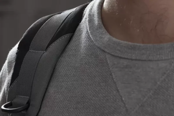 Overland Pro Dry Backpack with multiple mesh and zippered pockets for secure storage.